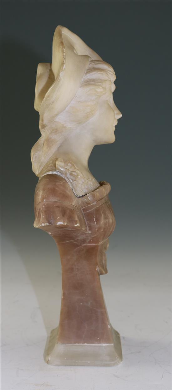 An Art Nouveau carved two colour alabaster bust of a young lady wearing a bonnet, 12in.